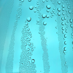Naklejka na ściany i meble Drops of water on the glass