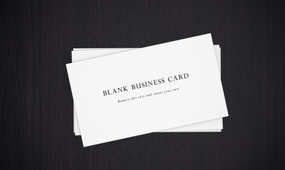 Business cards on dark background.