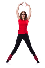 Young gymnast exercising on white