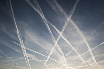 Airplane trails of condesed air in the sky
