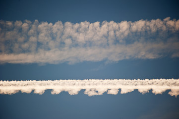 Horizondal aircraft trails in the sky