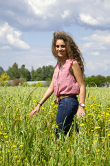Young woman on a field of flowers