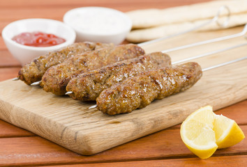 Seekh Kebabs - Minced meat kebabs on metal skewers
