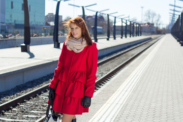Fototapeta premium woman waiting a train on the station