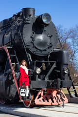 Fototapeta premium beautiful woman and vintage train