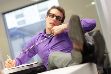 bad sitting posture - business man on phone