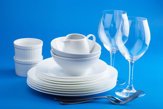 White Tableware Over Blue Background
