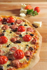 Peperoni Pizza with cherry tomatoes and olives