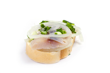 Sandwiches  with herring, onions and herbs on white background