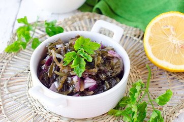 Salad from sea Kale with onion and lemon