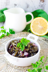 Salad from sea Kale with onion and lemon