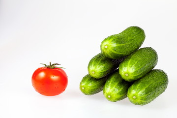 Pyramid from cucumbers and the adjoined tomato