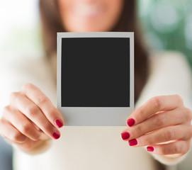 Woman Holding Blank Instant Photo