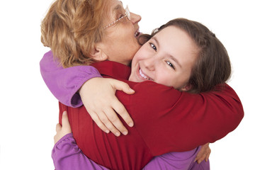Grandmother and granddaughter hugging
