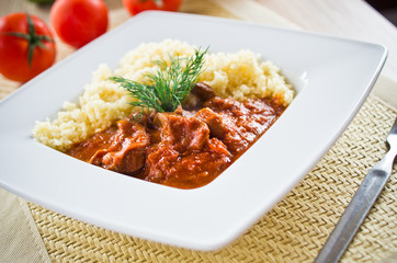 Tomato curry with couscous