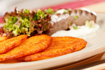 potato pancakes with sausages