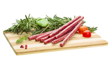 Salami with rosemary, basil and tomato