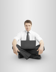 man sitting in lotus