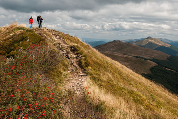 A couple of tourists hiking in the mountains © Krwawy