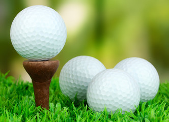 Golf balls on grass outdoor close up