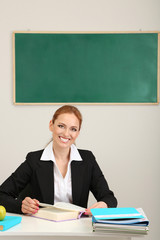 Portrait of teacher woman working in classroom