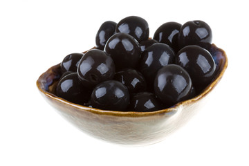 Olives black watered with olive oil in a bowl isolated on a whit