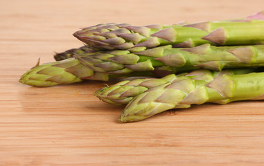 delicious asparagus on wooden background