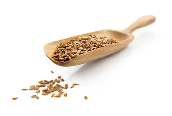 flax seed on spatula isolated on white background