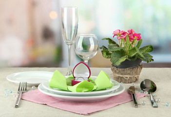 Romantic table serving on bright background