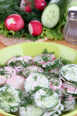 Vitamin vegetable salad in bowl on wooden table close-up