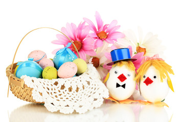 Easter eggs and two chicken toys isolated on white