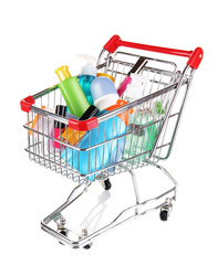 Cosmetics in cart isolated on white