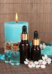 Fototapeta na wymiar Spa composition with aroma oils on table close-up