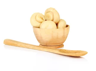 Fotobehang Mushrooms in wooden bowl, isolated on white © Africa Studio