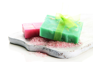 Natural handmade soap on wooden desk, isolated on white