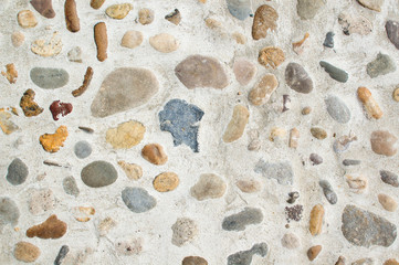 Various stones embedded in concrete