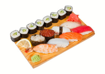 Sushi set on board isolated on white