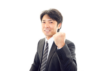 ガッツポーズのビジネスマン