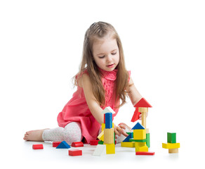 child girl playing with block toys over white background