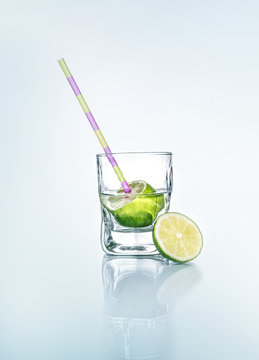 Vodka with lemon - lime and drinking straw