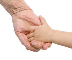 the hand of the grandmother holding a hand of the grandson