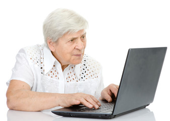 Portrait of a senior woman using laptop. isolated