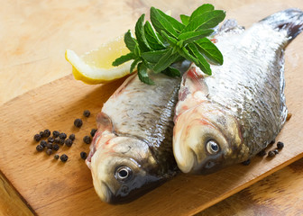 Fresh raw fish on wooden table