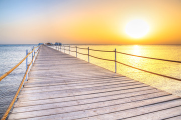 Obraz premium Pier on Red Sea in Hurghada at sunrise, Egypt