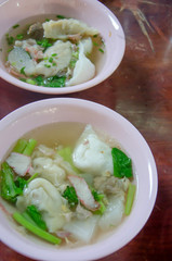 Wonton noodles.  vegetable and pork soup , asian noodles
