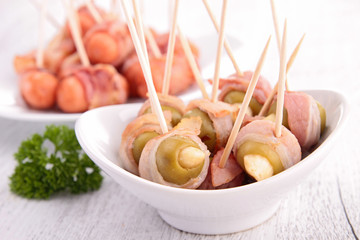 olive and sausage wrapped in bacon