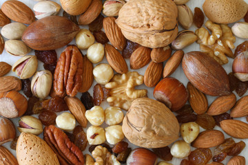 Selecion of nuts, almonds and sultanas, close up