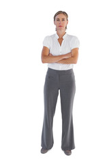 Serious businesswoman standing with her arms crossed