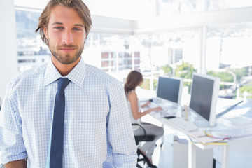 Portrait of smiling man in creative office