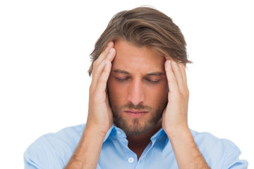 Fototapeta premium Handsome man touching his temples to calm a headache